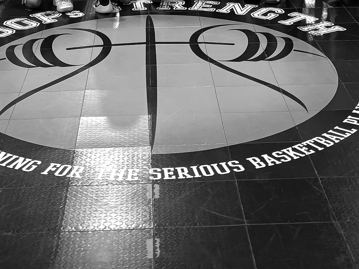 Empty half court with a Dr. Dish shooting machine ready